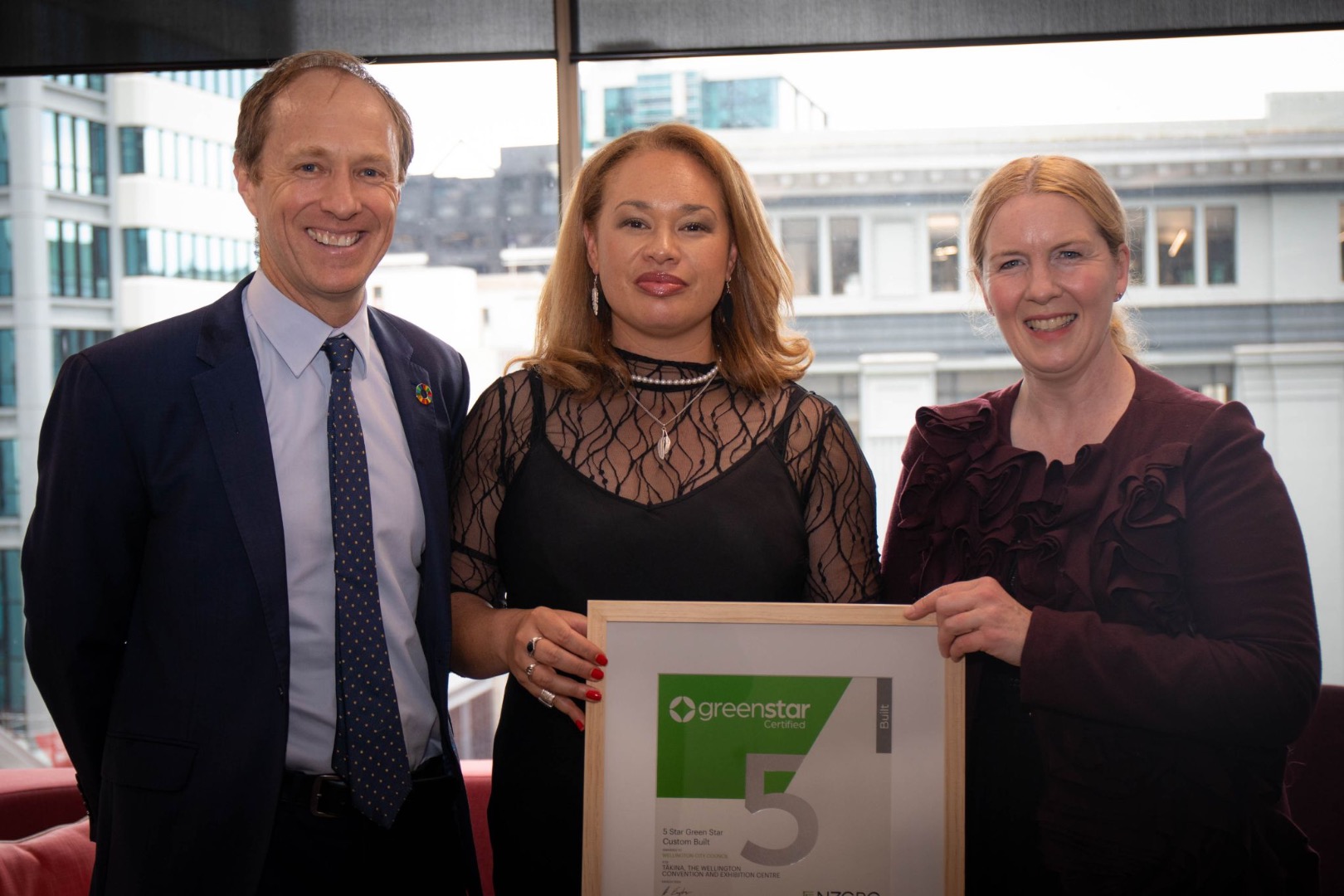 Andrew Eagles, CEO – NZ Green Building Council (left) presents Wellington Mayor Tory Whanau (centre) and Councillor Iona Pannett (right) with a 5-star Green Star certificate for Tākina Wellington Convention & Exhibition Centre.